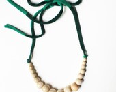 Color Pop Necklace in Vanilla & Green Stripe . Non-toxic Beads with a Jersey Tie . Fashionable and baby-friendly