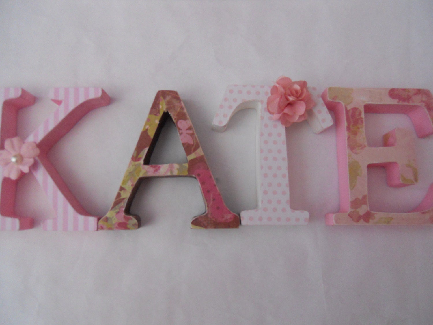 Wooden letters for nursery in pink, white and brown butterfly themed