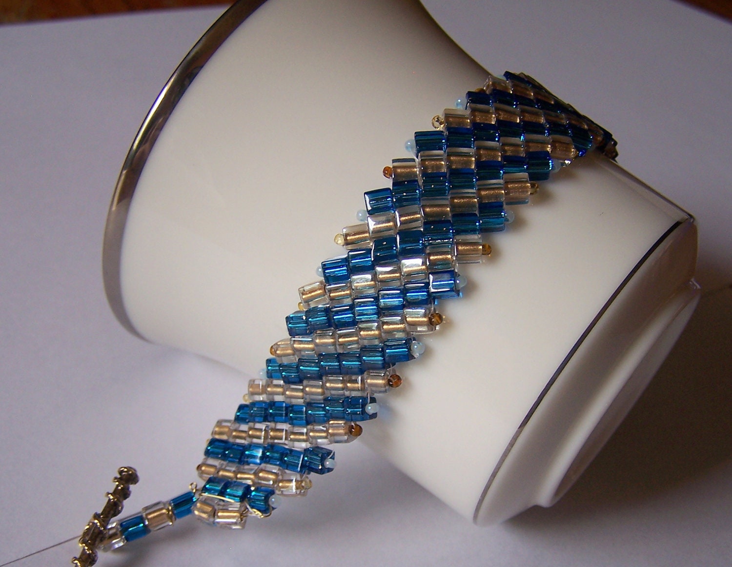 unique handmade Bead weaving bracelet, turquoise blue, gold, cube beads, striking, elegant, versatile,fun, handcrafted