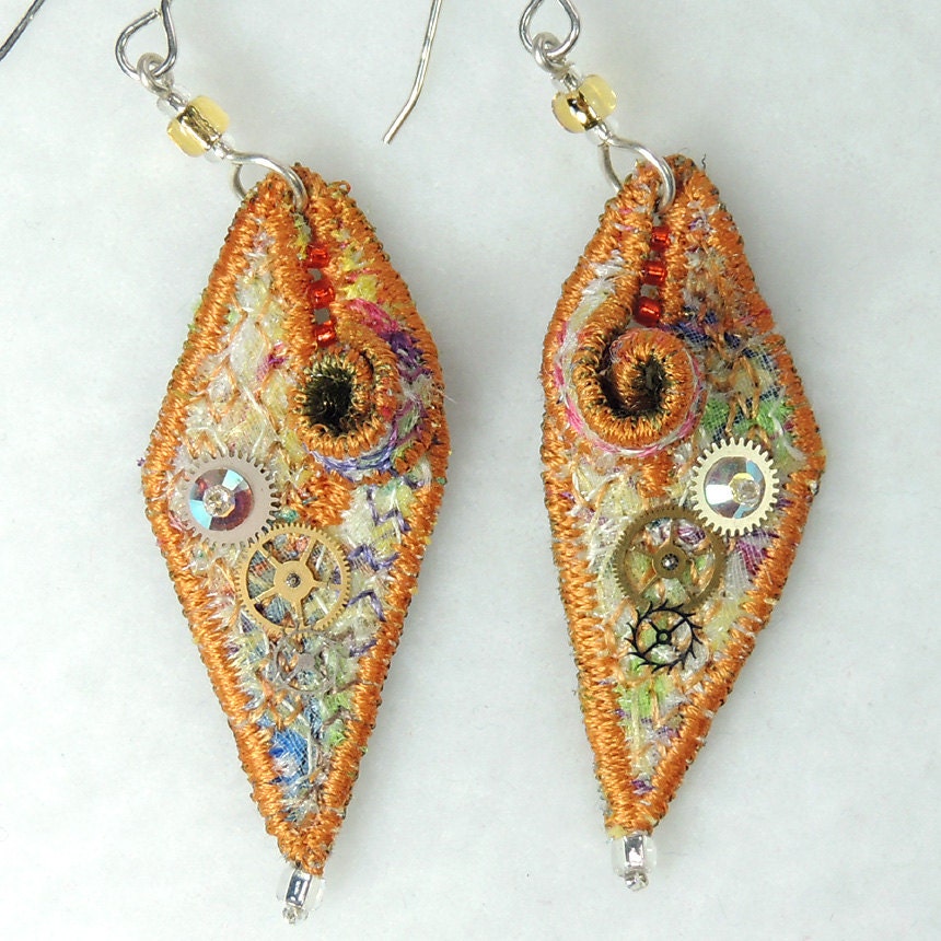 Textile earrings in orange with watch parts