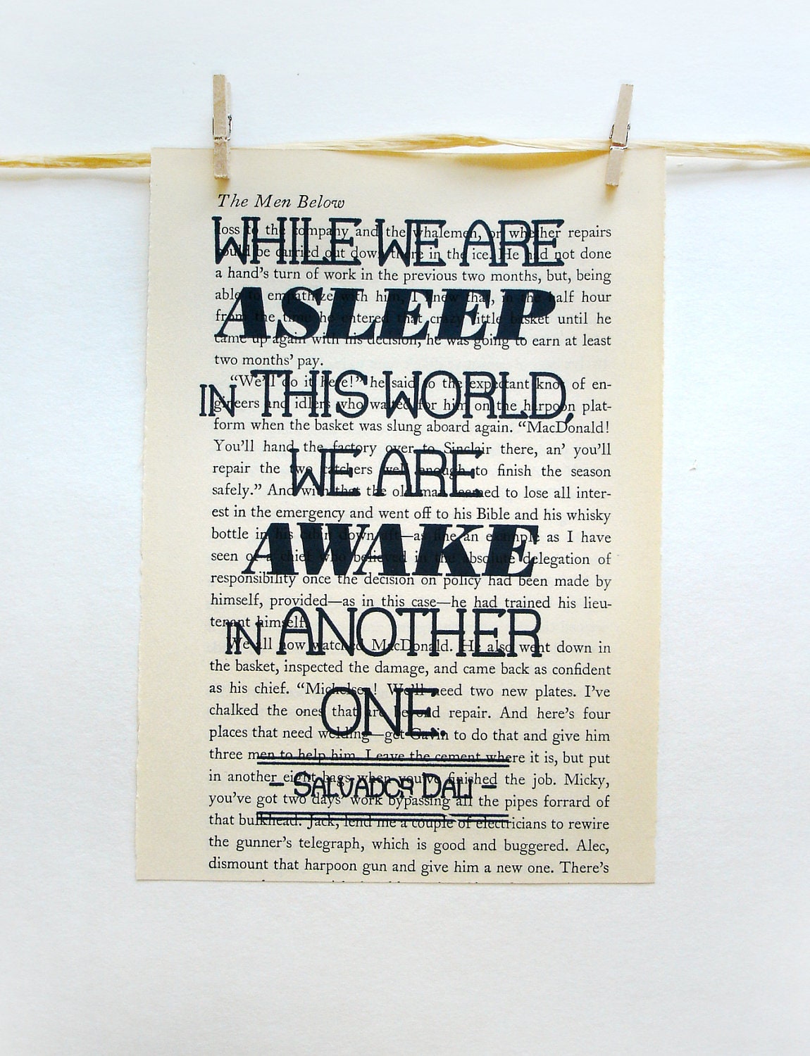 Book page inspirational quote by Salvador Dali printed on vintage book paper