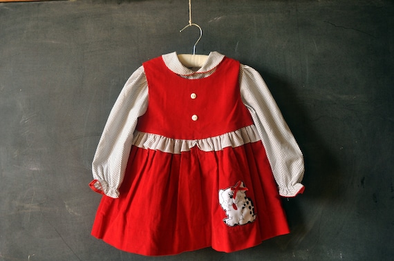 Two piece set, red corduroy dress, with puppy, and matching black and white polka dotted shirt, size 4T