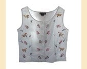 Vintage 1980s sleeveless blouse in white cotton with embroidered floral sprigs, UK size 14
