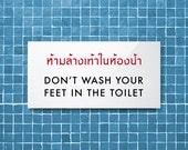 Funny Sign. Bathroom Sign. Toilet Sign. Restroom Sign. Thai Sign. Feet in the Toilet