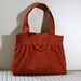 Pleated Handbag with Flap Closure in Burnt Orange