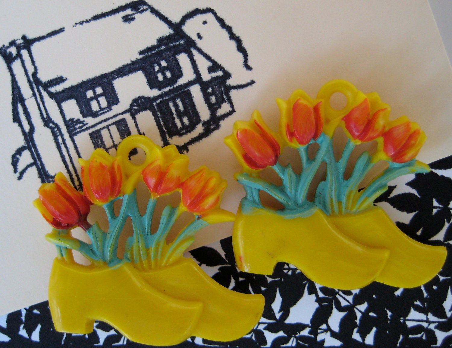 vintage pair of lucite dutch shoe push pin curtain tie backs with sprouting tulips - zuzuandolive