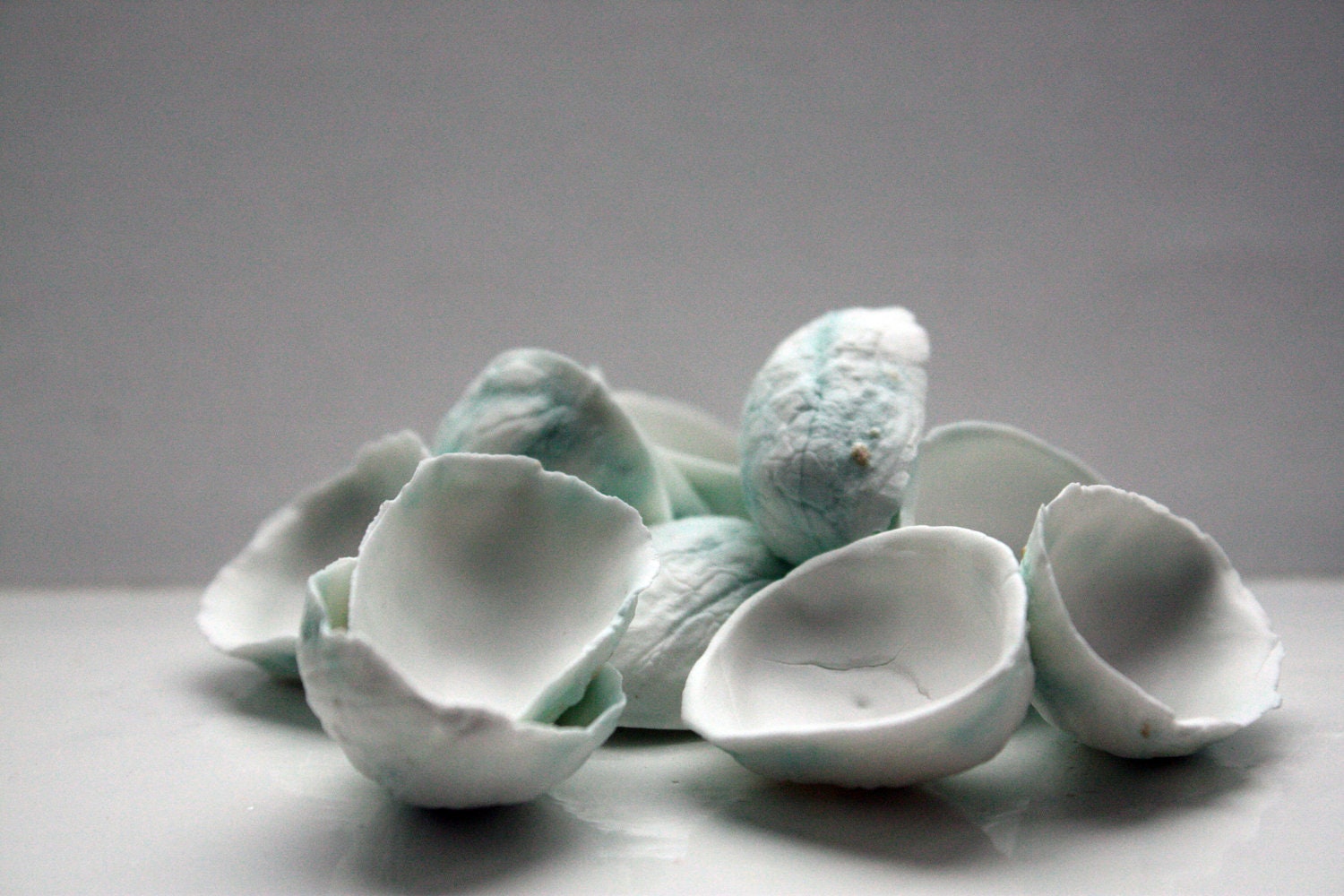 Walnut shells from stonewareng English fine bone china and copper oxide in teal color - madebymanos