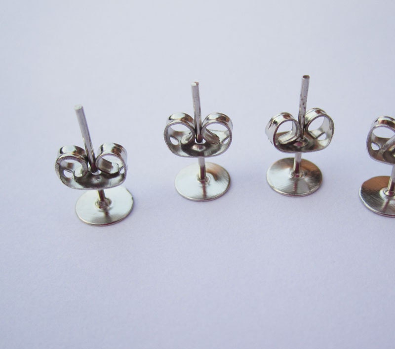 20 pairs Nickel Free Surgical Steel Stud Earnuts and 6mm Flat Pads,White K Earring Posts with Back Stoppers(Nickel free ).