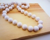 White beaded necklace. Vintage jewelry. Single strand, statement necklace. Long necklace. Great for layering.