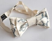 Nautical cream bow tie. Sailor Knots design. "KNOTical." Freestyle men's bowtie. Silkscreened ivory necktie, cobalt blue print.