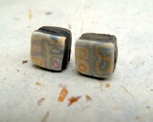 Tiny stacked polymer cube post earrings with dreamy mokume gane surface with blue, orange and plum lines