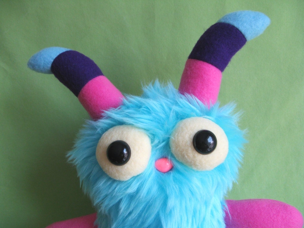 Monster toy stuffed animal plush with striped horns