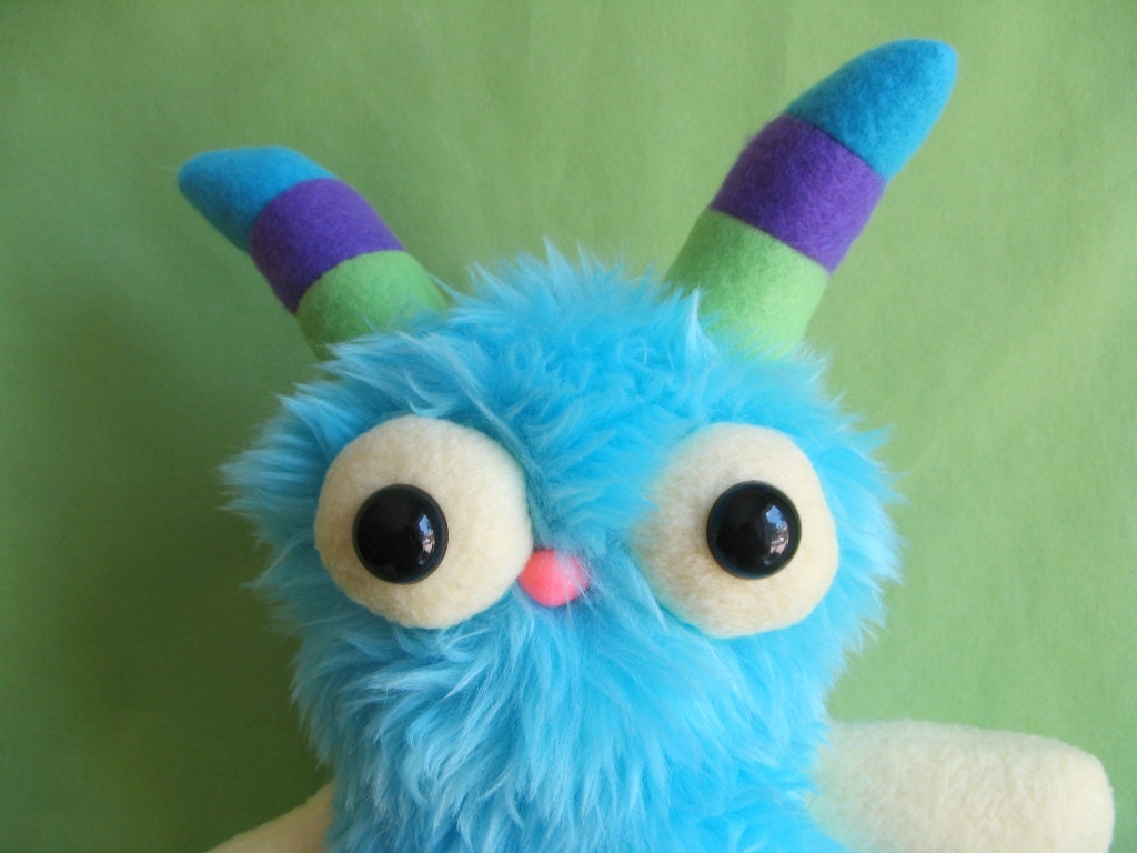 Monster toy stuffed animal plush with striped horns