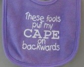 These Fools Put My Cape on Backwards Bib Purple White