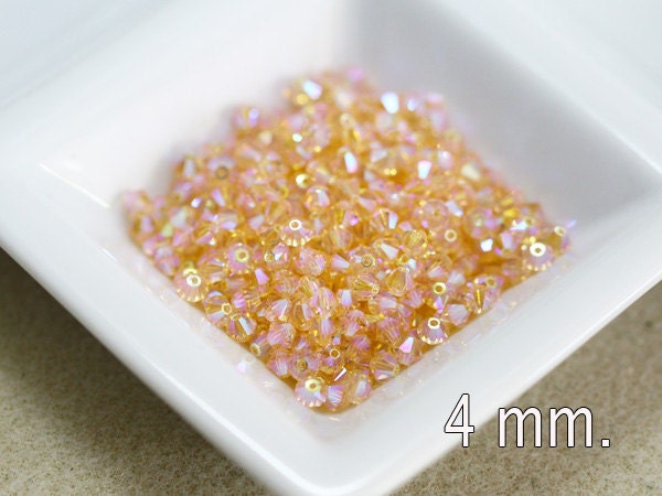 50 pcs. Swarovski Crystal Bicone Light Peach AB2X 4 mm.