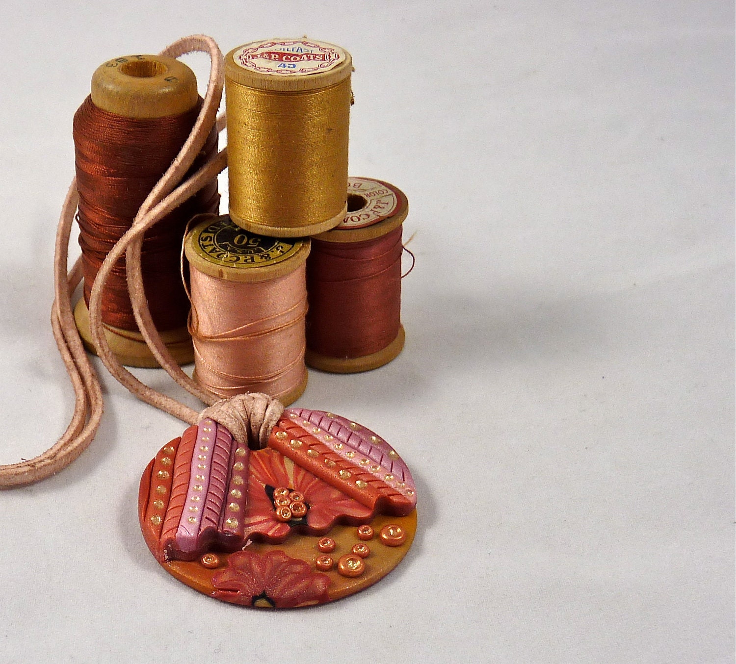 Polymer Clay Pendant in Rose and Gold Colors with Suede Cord