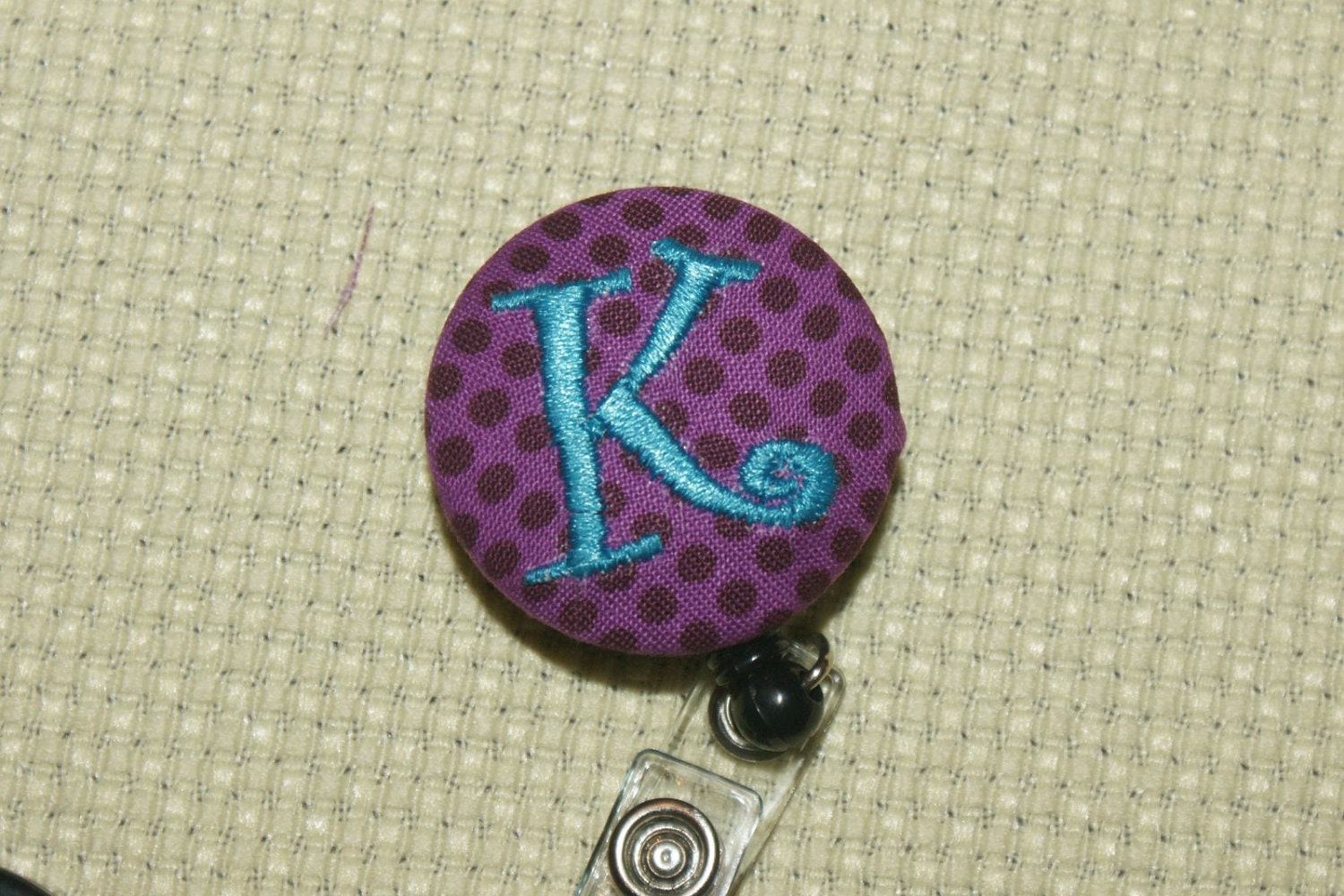 Many fabrics to design YOUR Badge Reel. Monogrammed single letter.  Plum purple dot