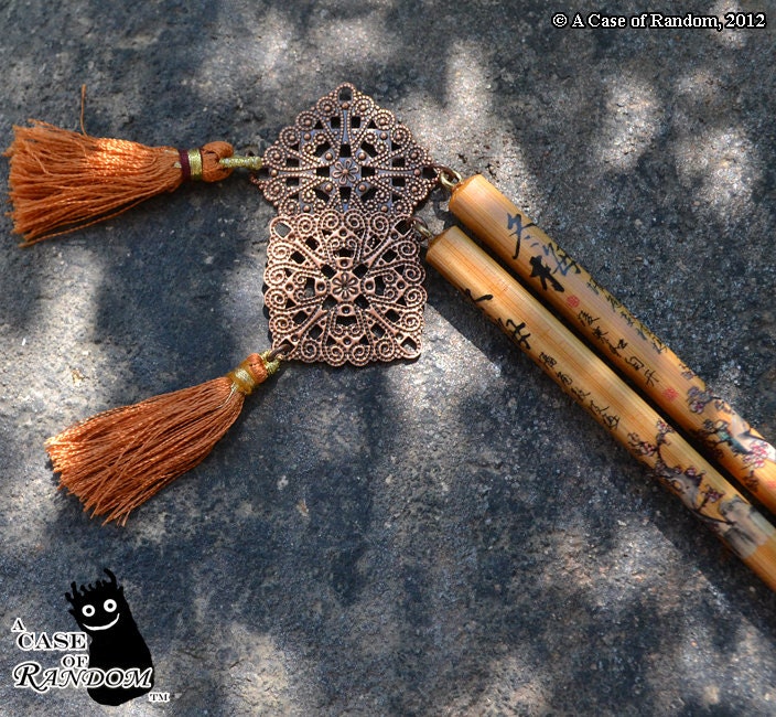 And Tassels -- 9" long hair sticks with bronze tassels and copper