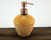 Amber glazed porcelain soap dispenser with brushed copper pump and straight sides