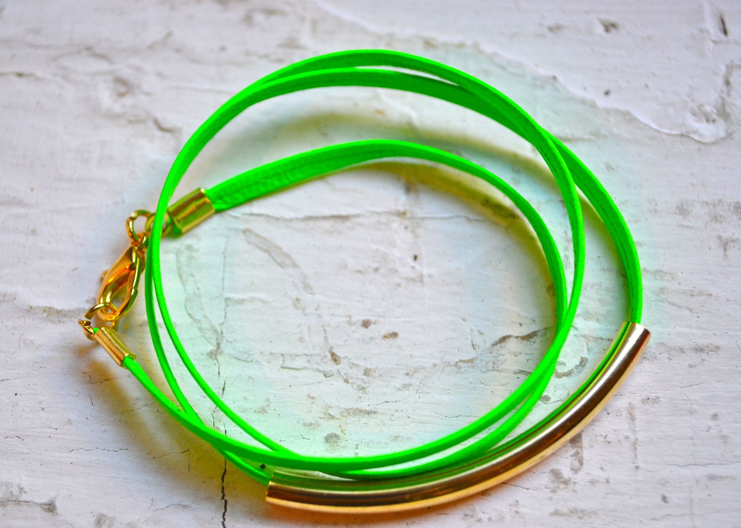 neon green skinny leather triple wrap bracelet with long gold tube