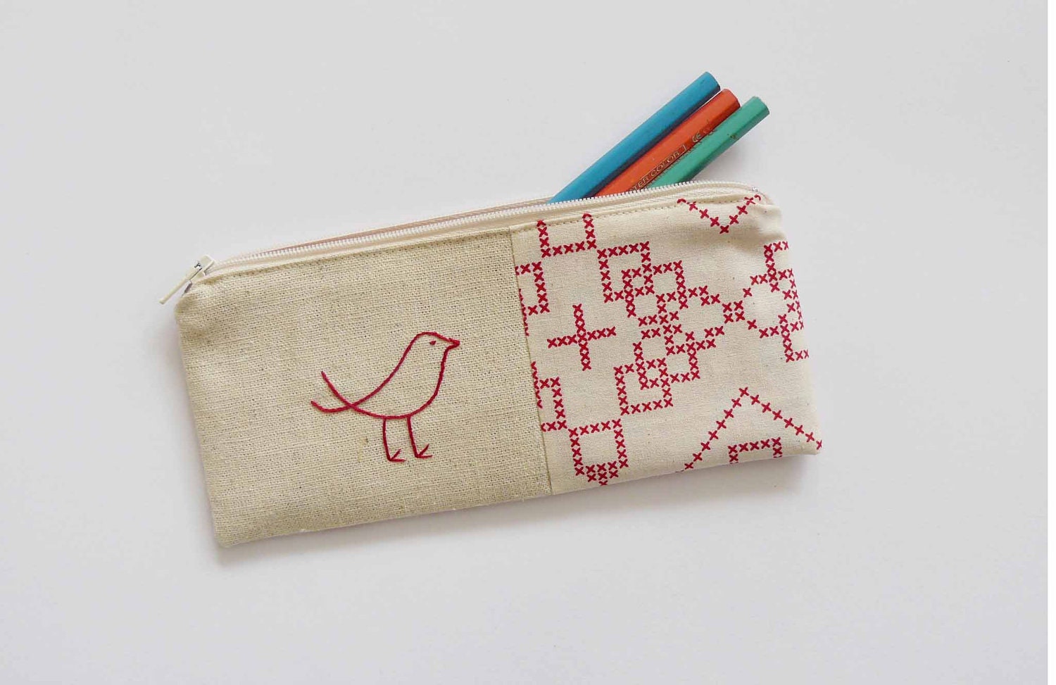 pencil case with red bird embroidery. cross stitch patterned taupe fabric