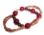 Unique statement bracelet red with bronze colours