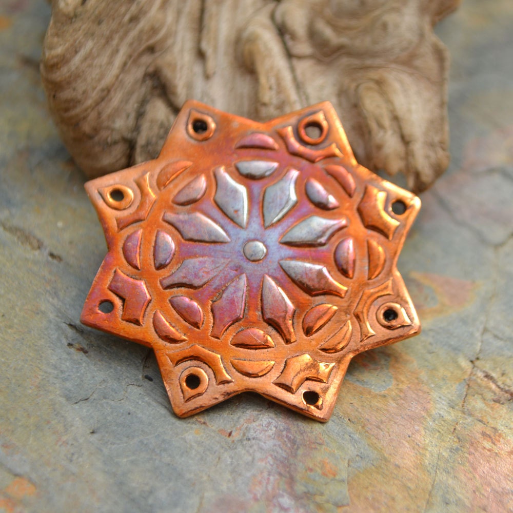 One (1) Copper 8 point Star, with 8 holes focal component
