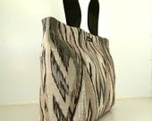 Tote in "Grey Ikat" fabric. Grey background with shades of warm grey. Ballistic nylon lining and base. Made in San Francisco.