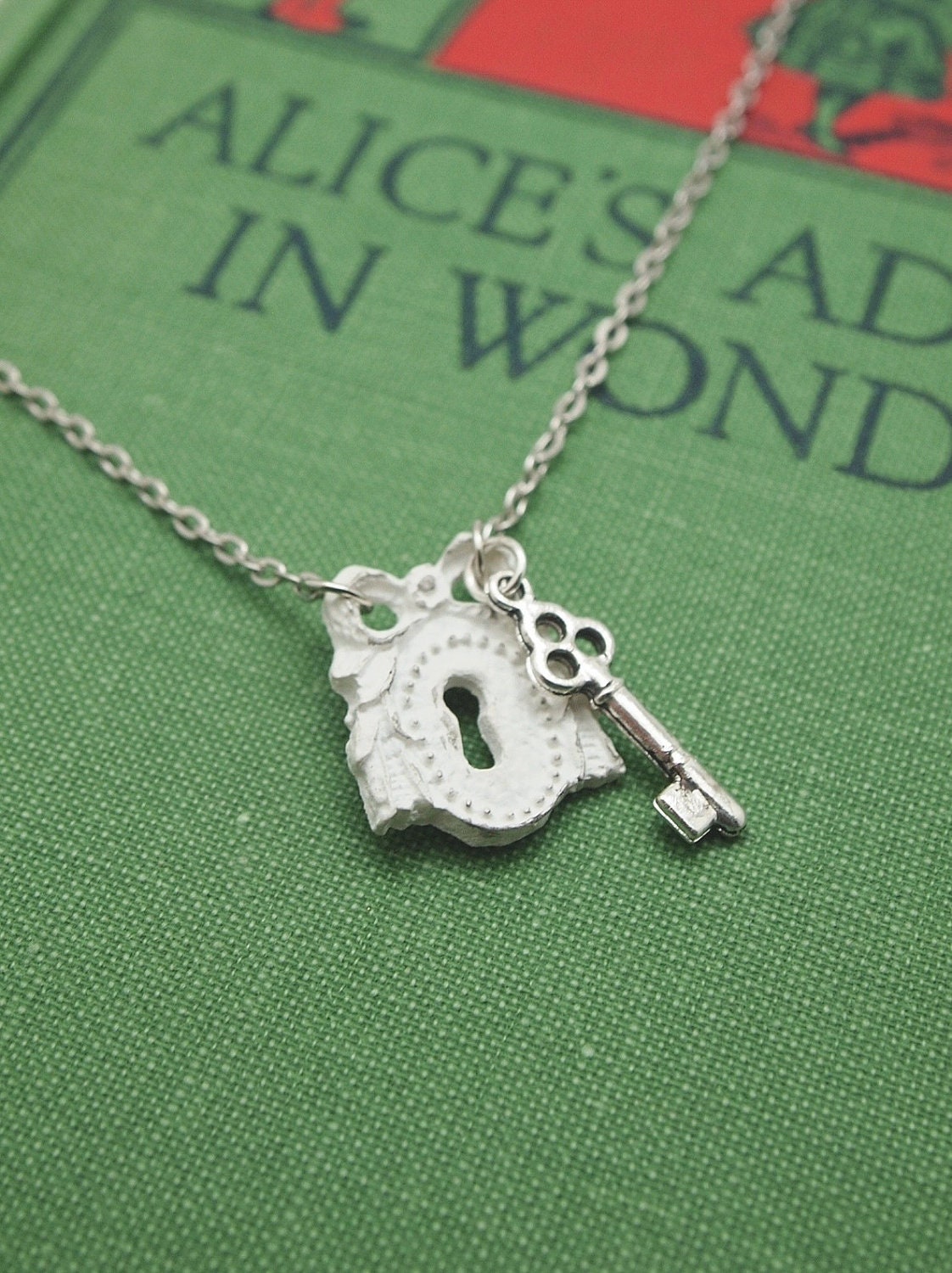 shabby chic keyhole necklace. vintaged white wood keyhole with small silver key charm