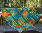 a stitch of color tummy time quilt for baby