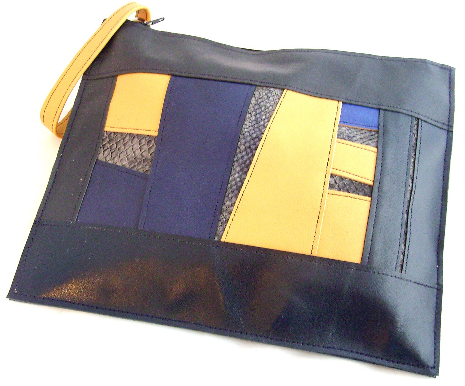 Navy & Yellow leather wristlet bag with salmon leather panels. Navy Leather clutch with detachable wrist strap.