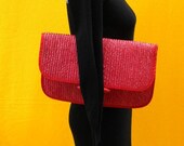 Red straw clutch purse