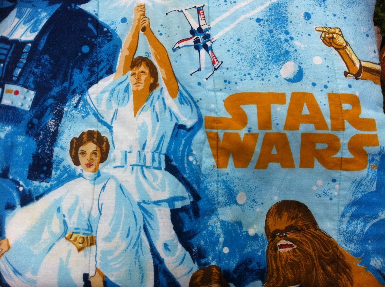 Vintage Star Wars sleeping bag featuring Luke, Princess Leia, Darth Vadar, C3PO and Chewbacca.