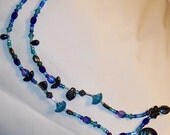 The Blues have it- dichroic glass lozenge anchors fabulous free-form collar necklace, face-framing charmer dotted with Swarovski bicones