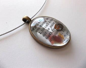 Cry Dictionary pendant with watchgear under glass