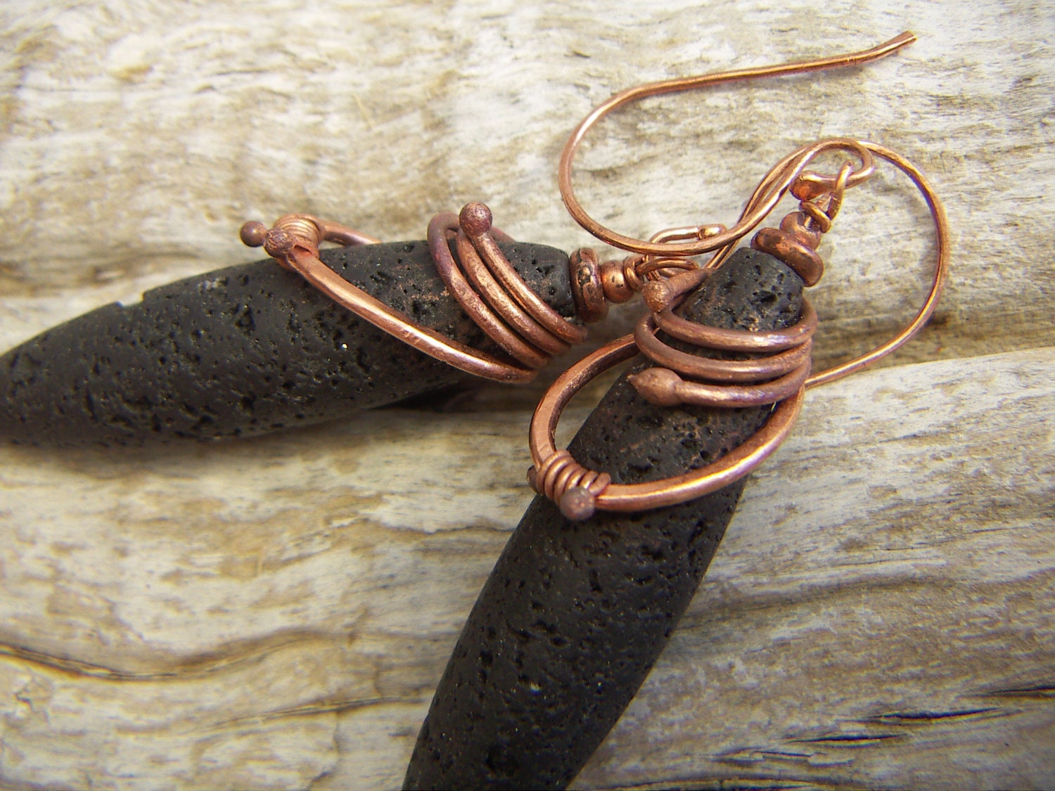 Long Oval Lava Earrings With a Copper Wrap