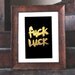 gilded poster: "fuck luck"