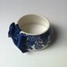 StayGoldMaryRose - Striking vintage blue willow pattern teacup bracelet with deep navy blue hand made satin bow.