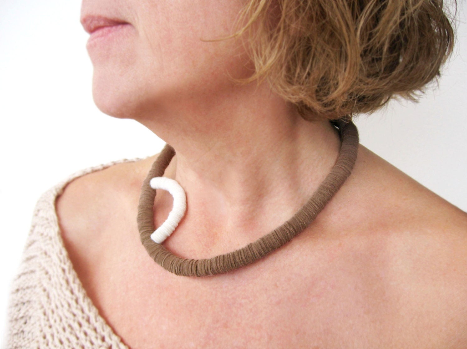 light brown geometric minimal felt necklace with a white curve - organic form contemporary jewelry
