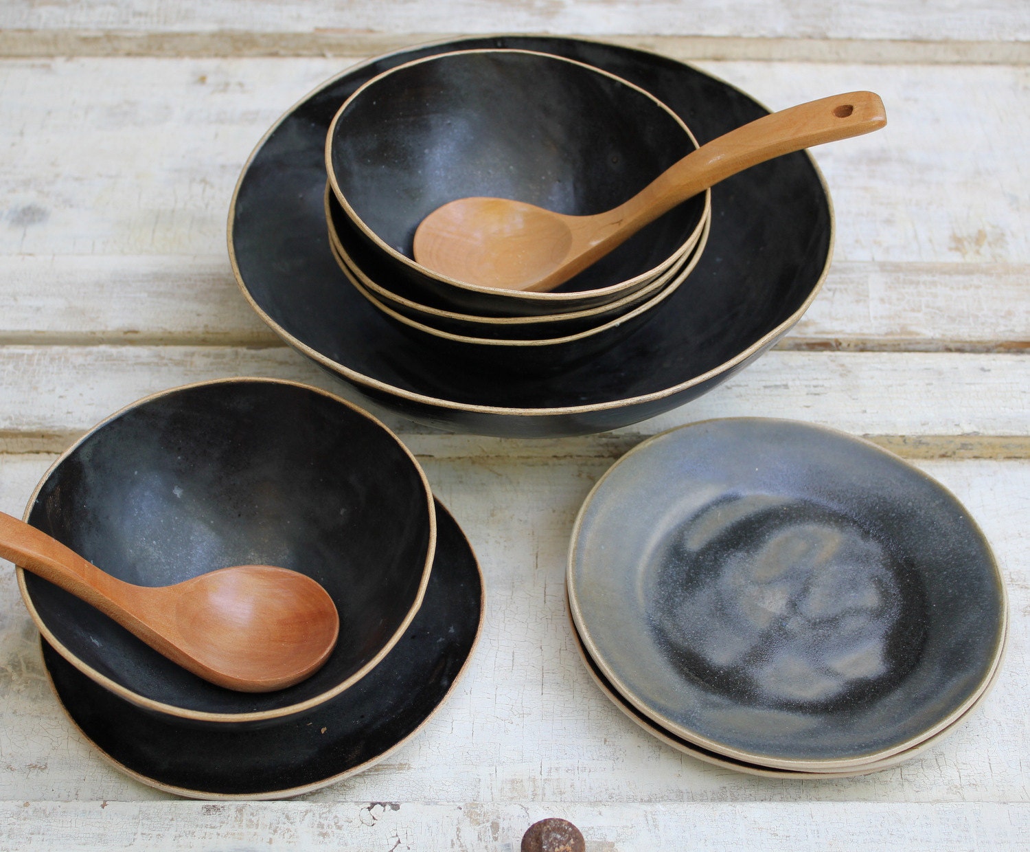 lovely black bowls with plates for soup or salad or cereal...