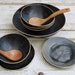 lovely black bowls with plates for soup or salad or cereal...
