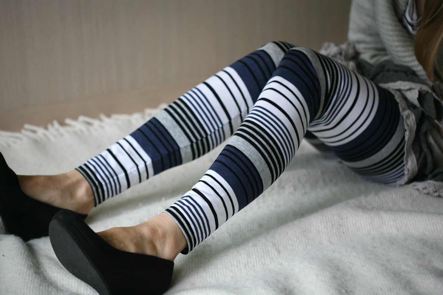 Blue leggings with white and black stripes