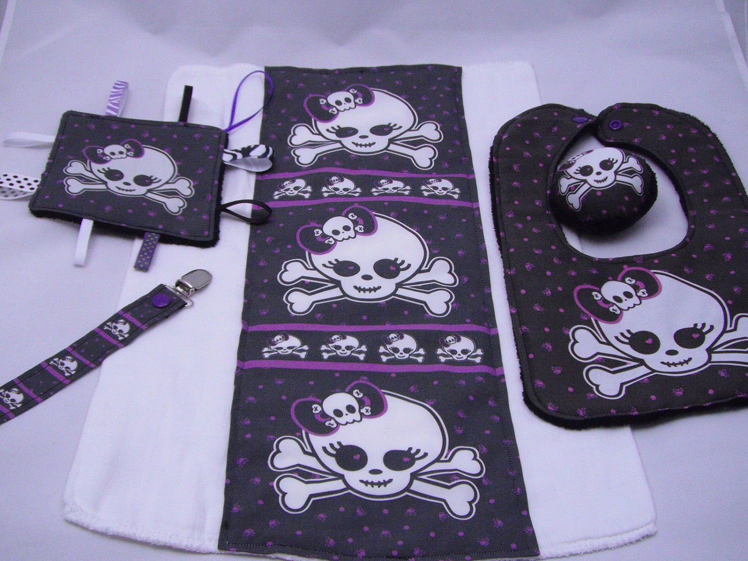 5 Pc Baby Gift Set Burp Cloth, Bib, Mini Tagged Lovey, Pacifier Clip and Rattle- Black w/ Purple Girly Mini Skull Crossbones GIRL Print