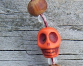 Beach Jewels. Wire Wrapped Sea Glass Pendant with carved Magnesite Skull bead ON SALE WAS 15.00