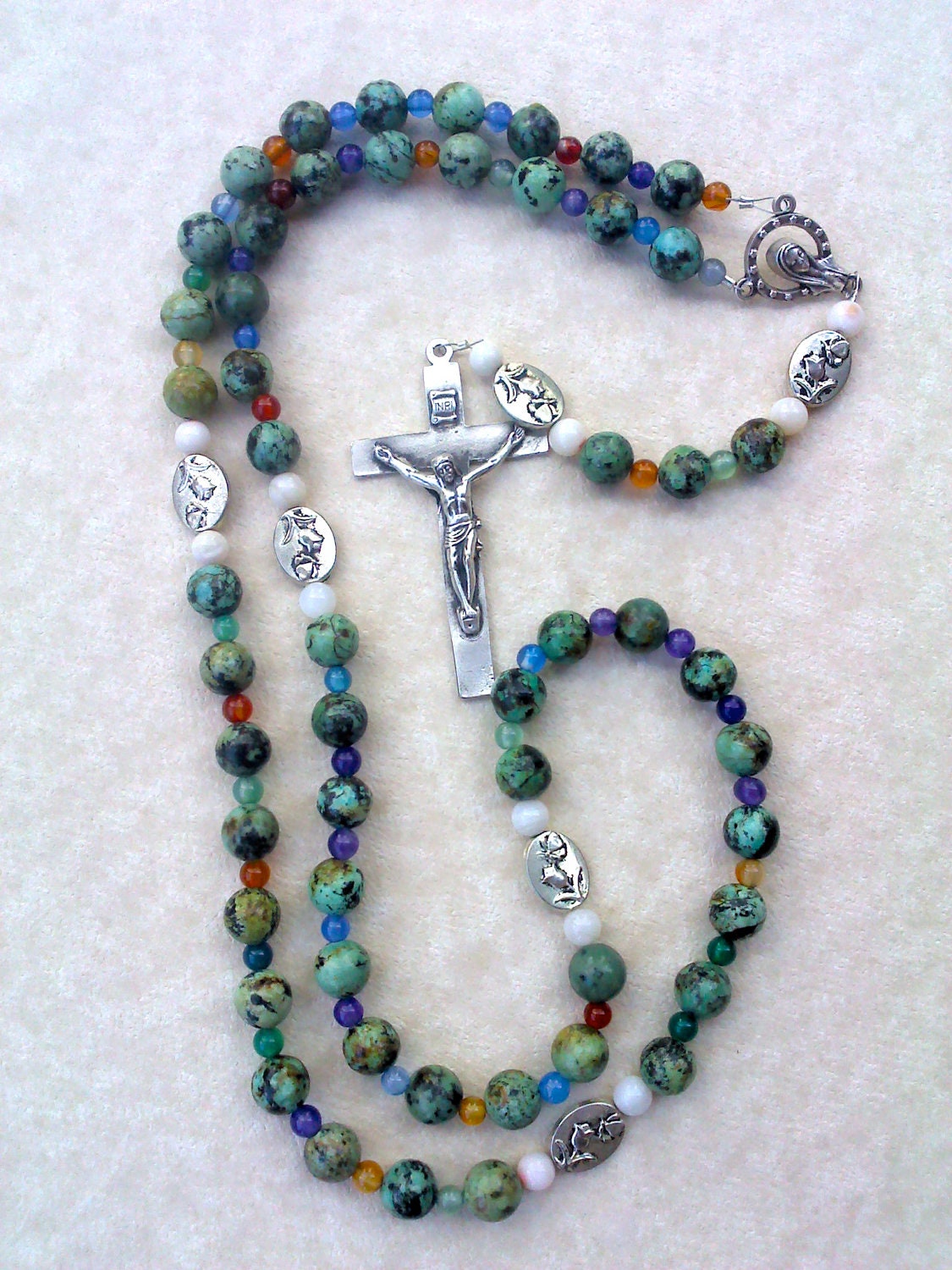 Rosary: green and black Ave beads and foral silver Pater beads