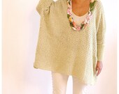 Oversized sweater with floral detailing.