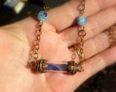 Blue sea glass in copper bottle, tiny vial necklace, Sea Glass Jewelry