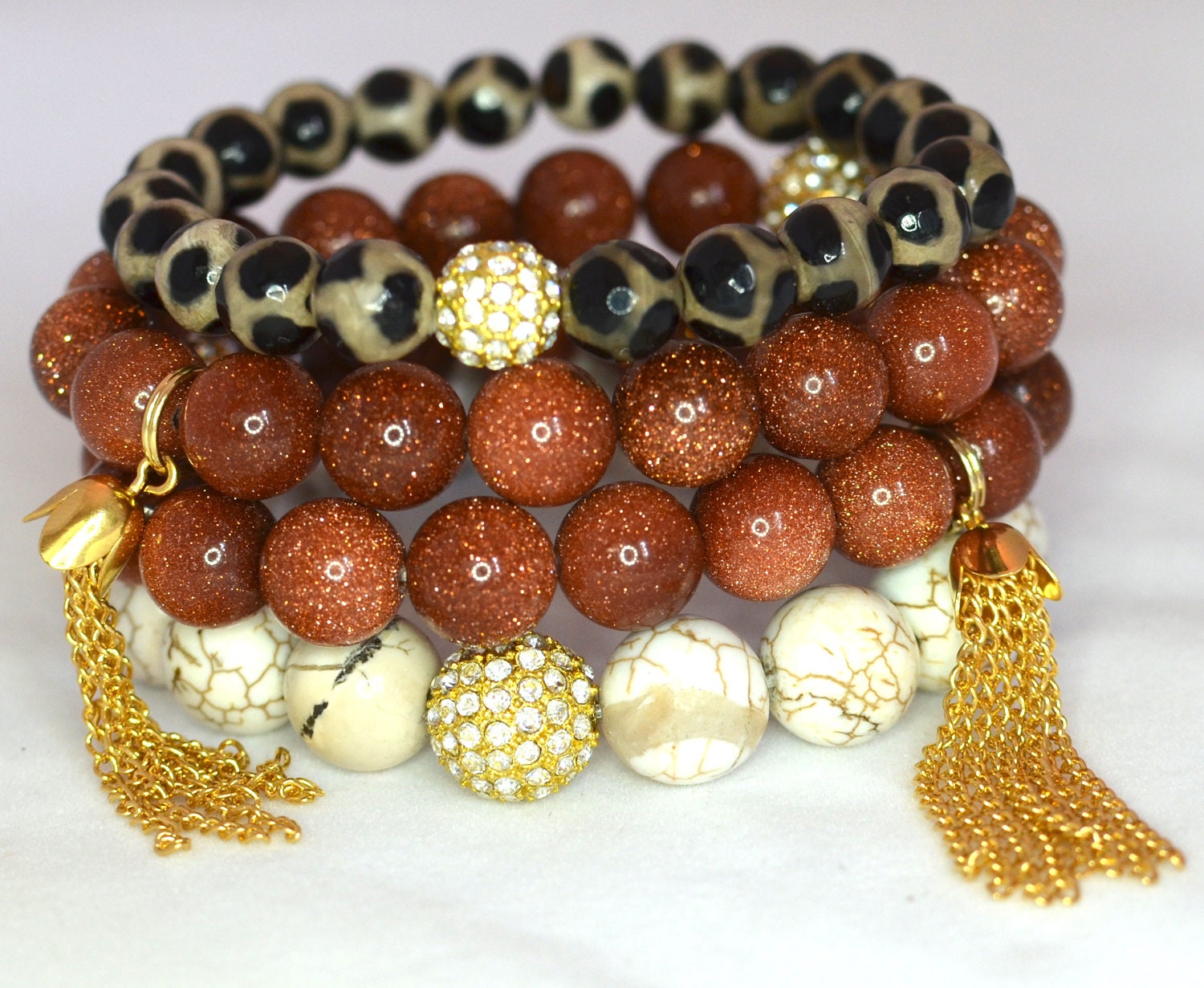 Spiced Goldstone, Ivory Magnesite and Faceted Agate Semi Precious Gemstone Beaded Bracelets with Gold Rhinestones & Tassels - Set of 4