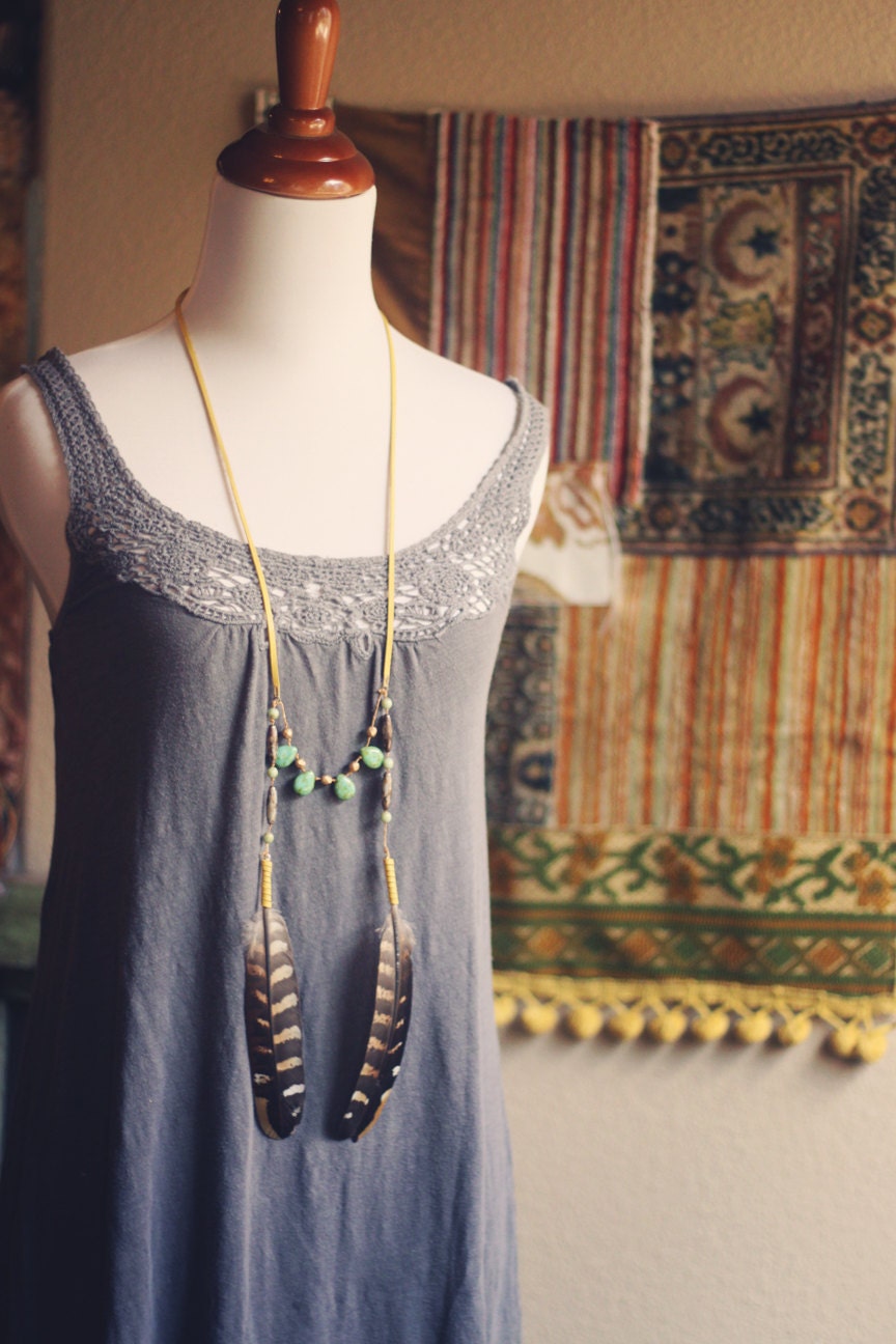 emmylou.  a bohemian beaded feather and deerskin necklace.