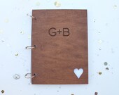 Custom wedding guest book with engraved initials and heart cutout